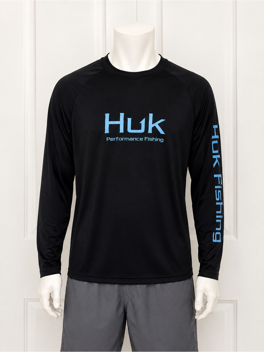 Huk Men's Black Long-Sleeve Performance Rash Guard with Blue Logo
